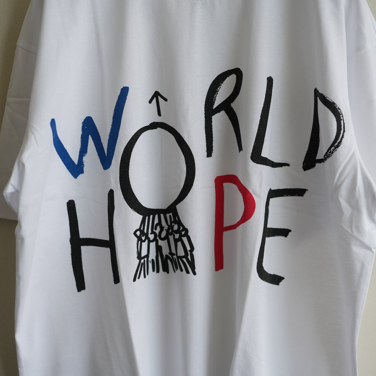 COMME des GARCONS SHIRT PRINTED BIG TEE WORLD HOPE